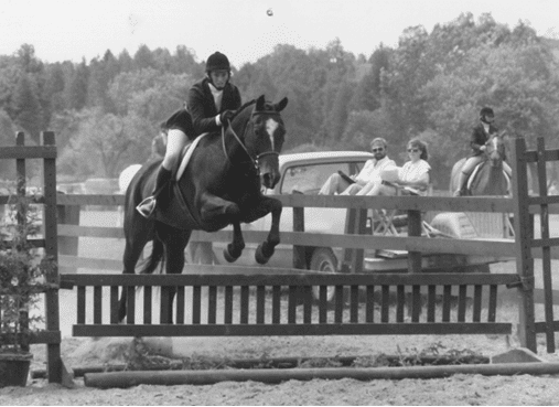 Rider and horse jumping at Teen Ranch